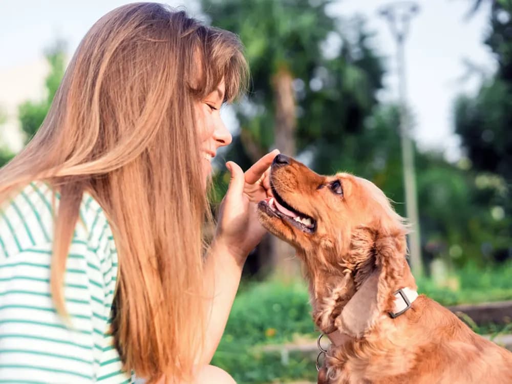 woman with dog smiling