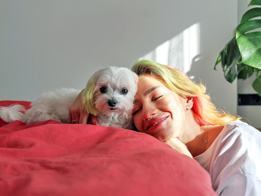 woman with lap maltese