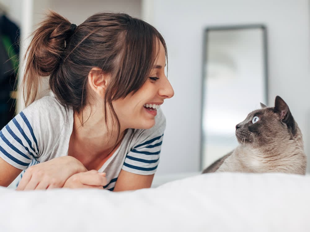 woman happy with her cat