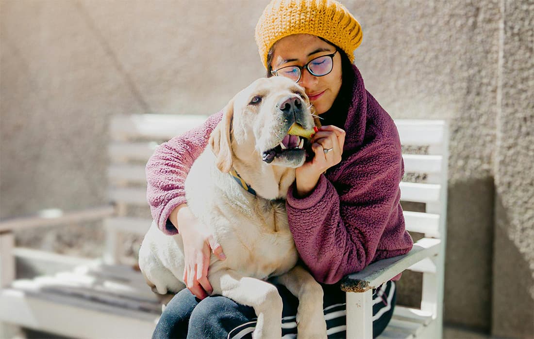 woman with labrador retriever