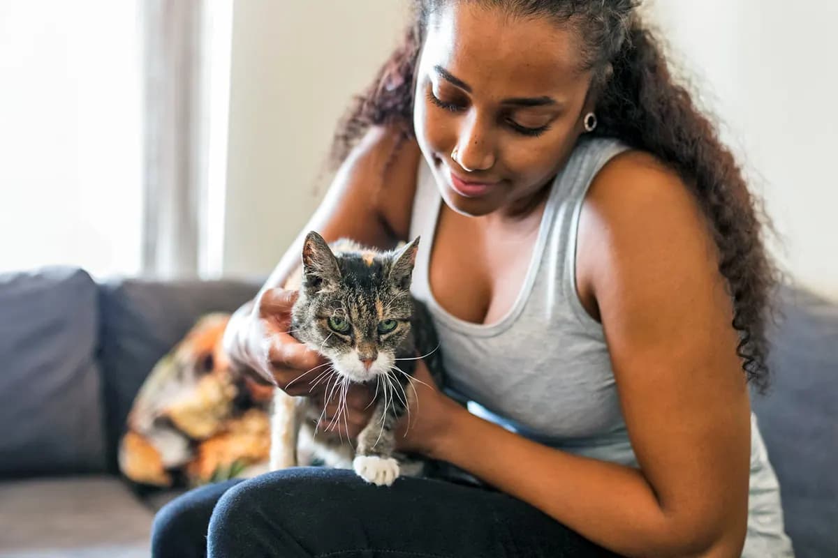 woman holding new cat
