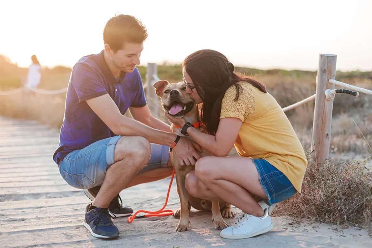 2 people with dog