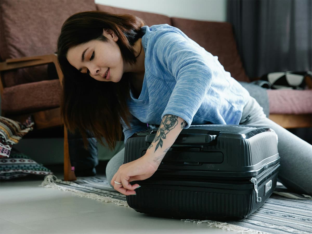 woman packing bags for emergency prep