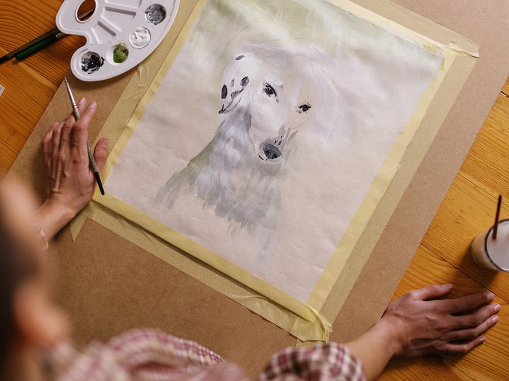 person painting a dog